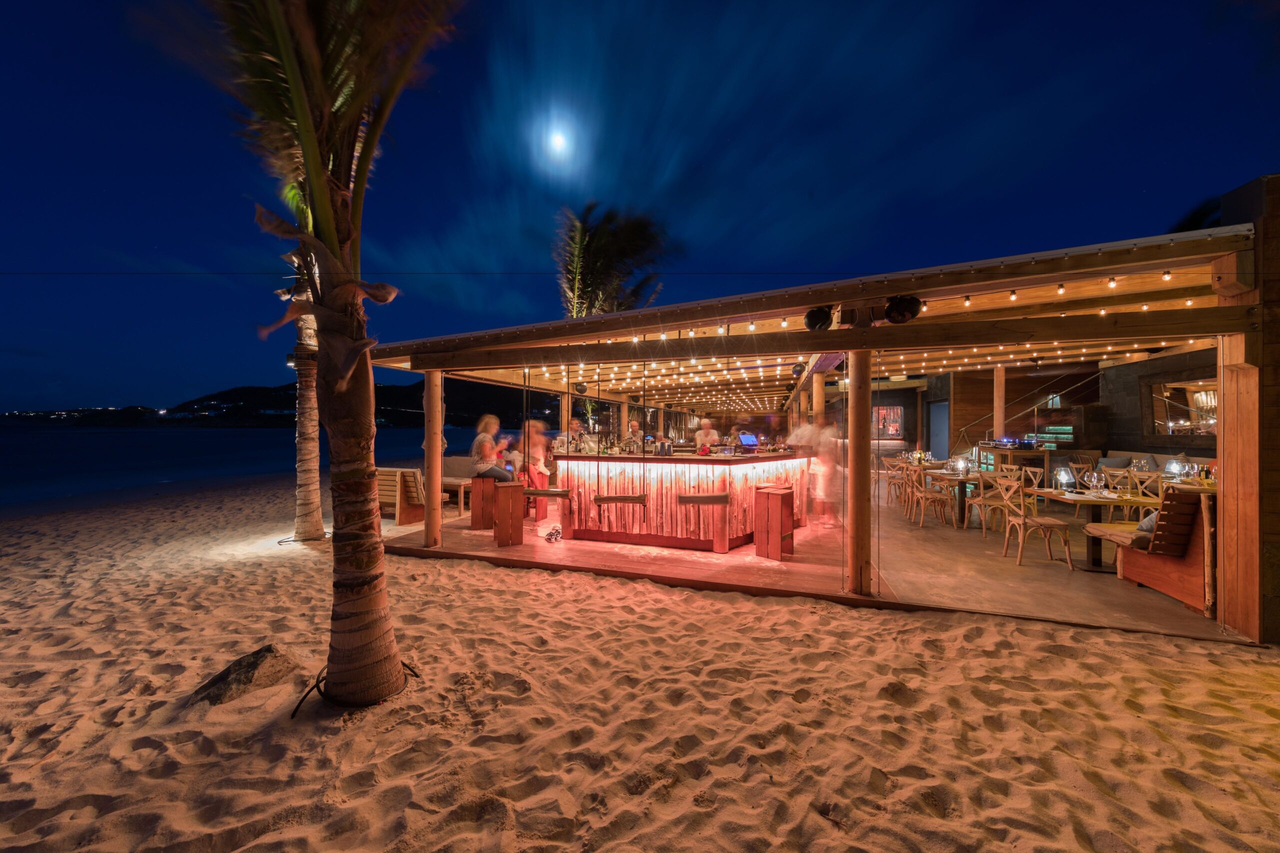 Beachfront dining at sunset