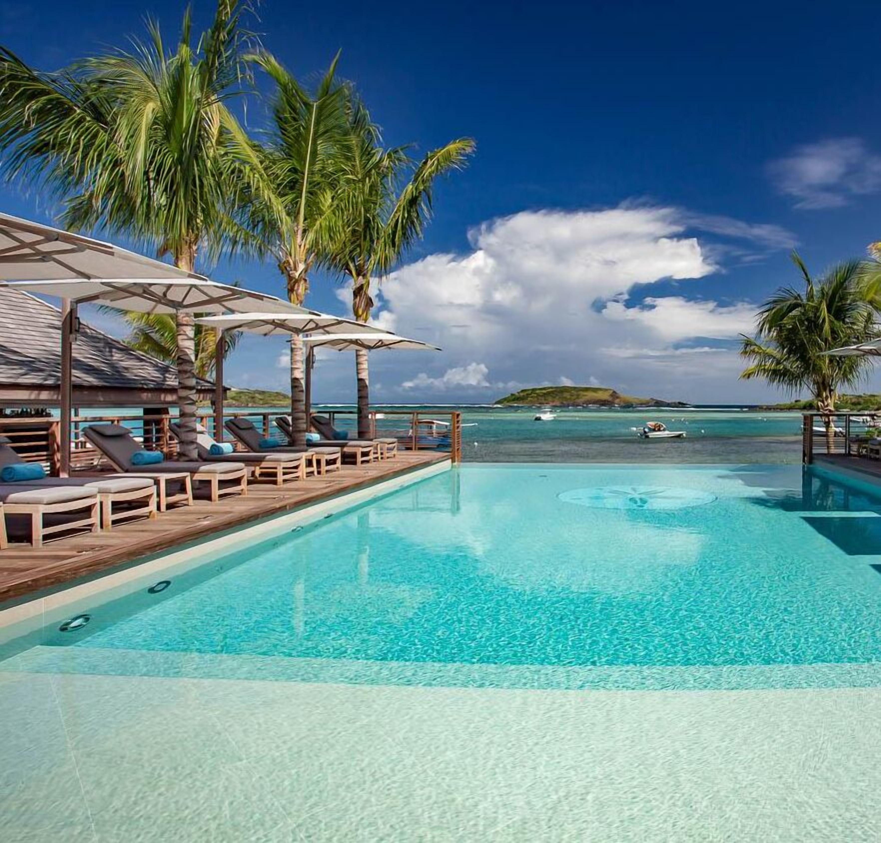 St Barts luxury villa private infinity pool Caribbean ocean view at sunset